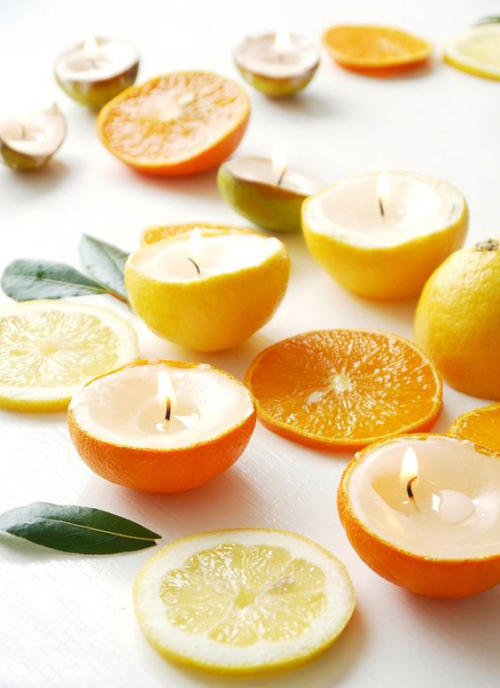 Les bougies fabriquées à la main couper les oranges ou les citrons en deux